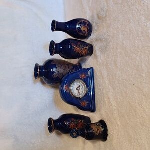 Handpainted blue porcelain vases clock and bell